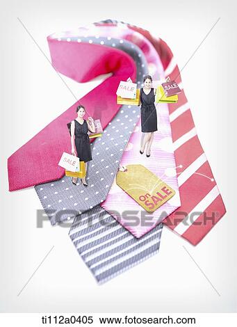 Shopping woman on the tie with sale tag View Large Photo Image Stock Photography - Shopping woman on the tie with sale tag. Fotosearch