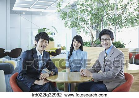 Smiling businessmen in the lounge View Large Photo Image Stock Image - Smiling businessmen in the lounge. Fotosearch