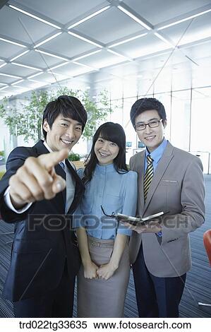 Stock Photography - Smiling businessmen in the lounge. Fotosearch