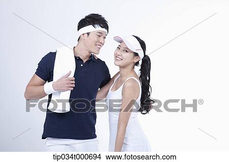 Smiling male and female tennis players View Large Photo Image Picture - Smiling male and female tennis players. Fotosearch