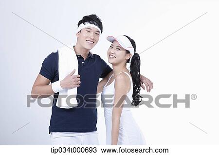 Smiling male and female tennis players View Large Photo Image Stock Image - Smiling male and female tennis players. Fotosearch