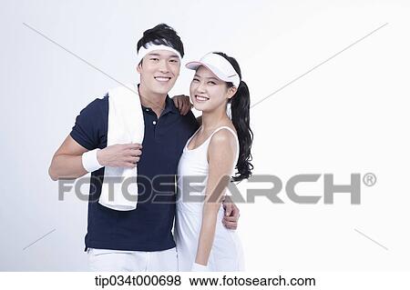 Smiling male and female tennis players View Large Photo Image Stock Photo - Smiling male and female tennis players. Fotosearch