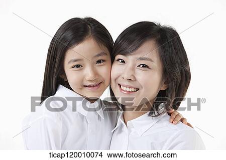 Smiling mother and daughter View Large Photo Image Picture - Smiling mother and daughter. Fotosearch