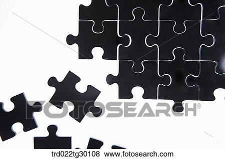 Some black pieces of puzzle out of other puzzles put together View Large Photo Image Stock Photo - Some black pieces of puzzle out of other puzzles put together. Fotosearch