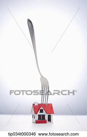 Speared house with the fork View Large Photo Image Stock Photograph - Speared house with the fork. Fotosearch