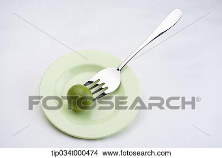 Speared lime with the fork View Large Photo Image Picture - Speared lime with the fork. Fotosearch