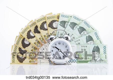 spreaded money bills and clock View Large Photo Image Stock Photography - spreaded money bills and clock. Fotosearch