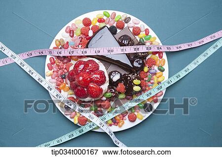 Sweet dessert with measuring tape View Large Photo Image Stock Photo - Sweet dessert with measuring tape. Fotosearch