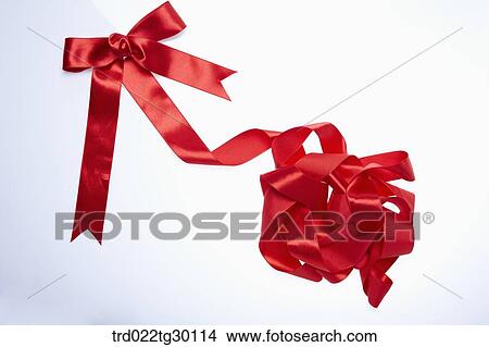 Picture - Tangled red ribbon. Fotosearch