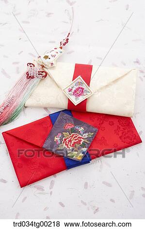 Traditional cloth envelope and clothes accessory View Large Photo Image Stock Photo - Traditional cloth envelope and clothes accessory. Fotosearch