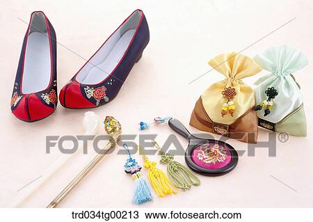 Stock Image - Traditional shoes, decorations, and lucky bags. Fotosearch
