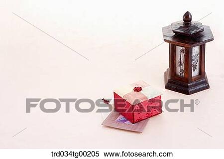 Stock Photography - Traditonal box and coasters with traditional lamp . Fotosearch