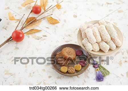Various Korean dessert with persimmons behind View Large Photo Image Stock Photograph - Various Korean dessert with persimmons behind . Fotosearch