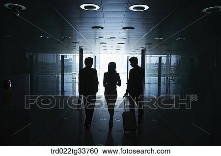 Stock Image - Walking businessmen in the hallway. Fotosearch