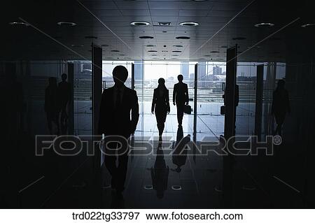 Walking businessmen in the hallway View Large Photo Image Stock Photo - Walking businessmen in the hallway. Fotosearch