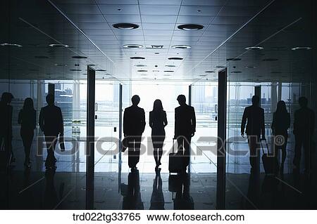 Walking businessmen in the hallway View Large Photo Image Stock Photography - Walking businessmen in the hallway. Fotosearch