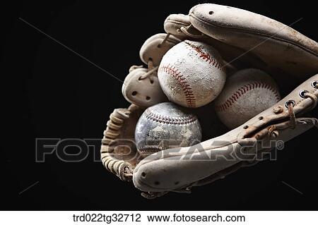 Worn out baseballs in a glove View Large Photo Image Stock Image - Worn out baseballs in a glove. Fotosearch