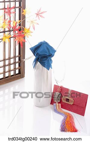 Wrapped bottles, a glass, and red envelope with Korean traditional door behind View Large Photo Image Stock Image - Wrapped bottles, a glass, and red envelope with Korean traditional door behind. Fotosearch