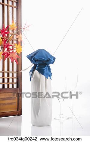Wrapped bottles, a glass, and red envelope with Korean traditional door behind View Large Photo Image Stock Image - Wrapped bottles, a glass, and red envelope with Korean traditional door behind. Fotosearch