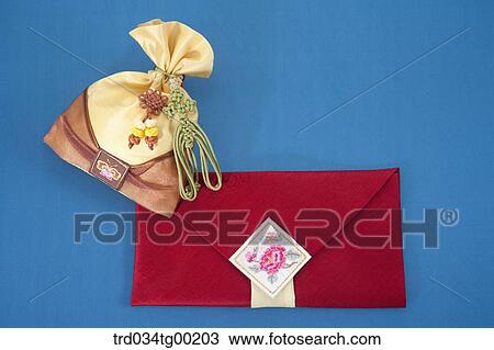 Yellow lucky bag and red cloth envelope View Large Photo Image Stock Image - Yellow lucky bag and red cloth envelope. Fotosearch