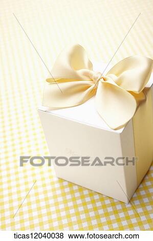 Stock Photo - Yellow ribbon gift box. Fotosearch