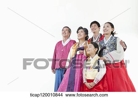 a big family in Hanbok facing same place smiling View Large Photo Image Picture - a big family in Hanbok facing same place smiling. Fotosearch