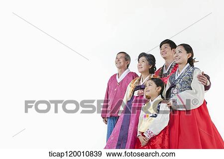 a big family in Hanbok facing same place smiling View Large Photo Image Stock Photo - a big family in Hanbok facing same place smiling. Fotosearch