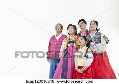 a big family in Hanbok facing same place smiling View Large Photo Image Stock Photograph - a big family in Hanbok facing same place smiling. Fotosearch