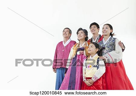 a big family in Hanbok facing same place smiling View Large Photo Image Stock Photography - a big family in Hanbok facing same place smiling. Fotosearch