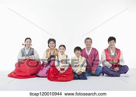 a big family sitting on the floor wearing Hanbok View Large Photo Image Picture - a big family sitting on the floor wearing Hanbok. Fotosearch
