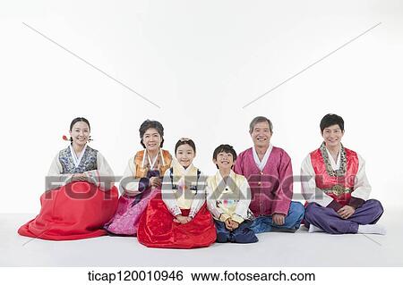 a big family sitting on the floor wearing Hanbok View Large Photo Image Stock Photograph - a big family sitting on the floor wearing Hanbok. Fotosearch