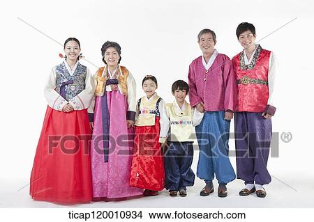 a big family standing in a line wearing Hanbok View Large Photo Image Picture - a big family standing in a line wearing Hanbok. Fotosearch