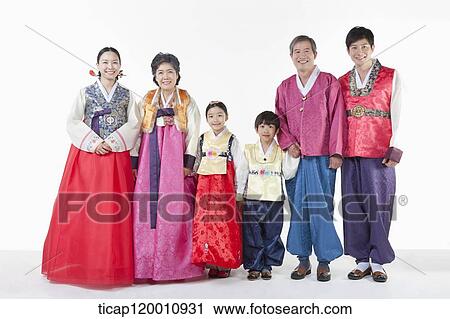 Stock Image - a big family standing in a line wearing Hanbok. Fotosearch