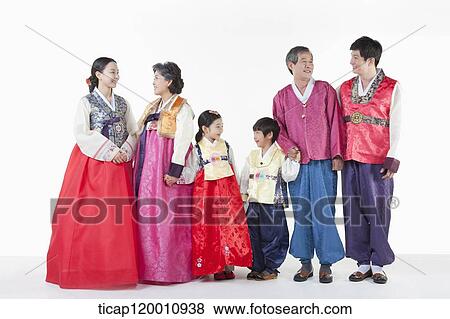 a big family standing in a line wearing Hanbok View Large Photo Image Stock Photo - a big family standing in a line wearing Hanbok. Fotosearch
