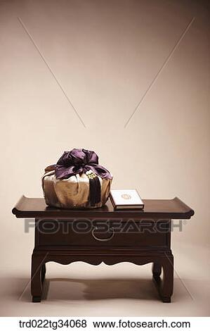 Stock Photo - a book and a package in Korean traditional wrap. Fotosearch
