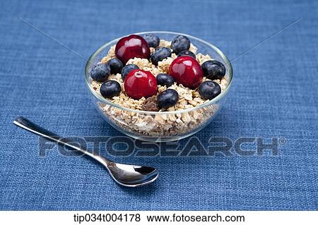 a bowl of cereal and a spoon View Large Photo Image Stock Photo - a bowl of cereal and a spoon. Fotosearch