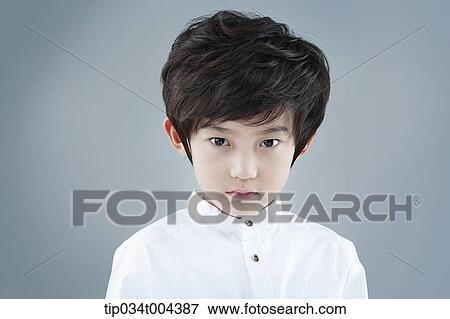 a boy in white shirt staring View Large Photo Image Stock Photo - a boy in white shirt staring. Fotosearch