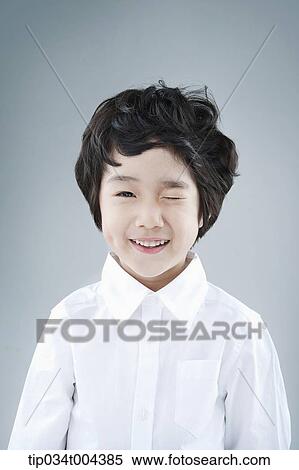 a boy in white shirt winking View Large Photo Image Stock Photography - a boy in white shirt winking. Fotosearch