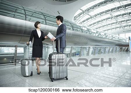 a businessman and woman discussing in Incheon airport View Large Photo Image Stock Photograph - a businessman and woman discussing in Incheon airport. Fotosearch