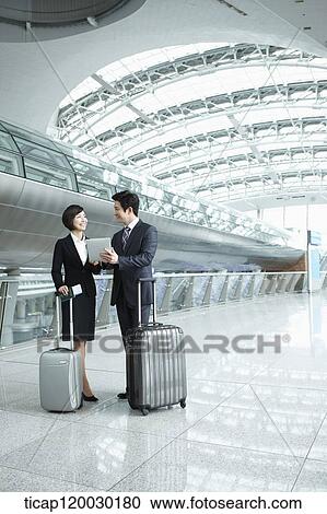 a businessman and woman discussing with document in Incheon airport View Large Photo Image Stock Image - a businessman and woman discussing with document in Incheon airport. Fotosearch