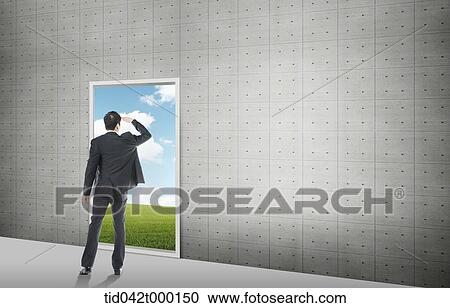 a businessman looking out a door View Large Photo Image Stock Image - a businessman looking out a door . Fotosearch