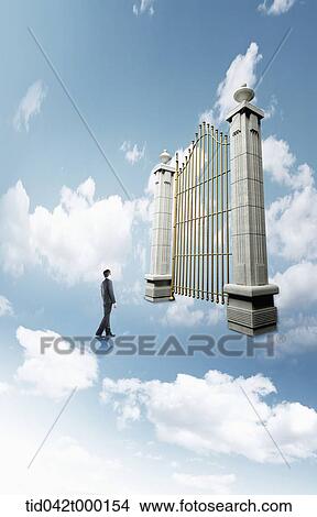 a businessman standing in front of a huge heaven's gate View Large Photo Image Picture - a businessman standing in front of a huge heaven's gate. Fotosearch