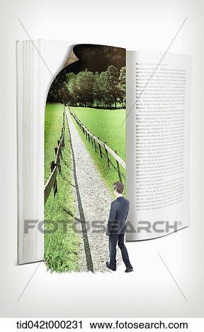 Stock Image - a businessman stepping into a picture in a book. Fotosearch