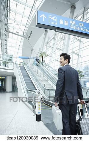 a businessman watching with a luggage in a Incheon airport View Large Photo Image Stock Photo - a businessman watching with a luggage in a Incheon airport . Fotosearch