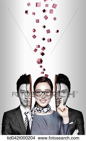 a businesswoman between businessmen with 3d cubes over her head View Large Photo Image Picture - a businesswoman between businessmen with 3d cubes over her head . Fotosearch