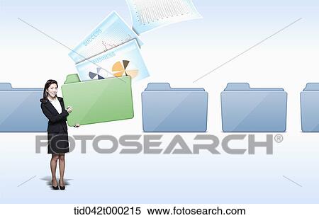 a businesswoman holding a computer folder View Large Photo Image Stock Photography - a businesswoman holding a computer folder. Fotosearch