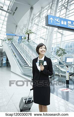 Stock Photograph - a businesswoman in a Incheon airport. Fotosearch