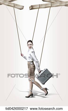 Stock Photo - a businesswoman puppet with strings attached . Fotosearch