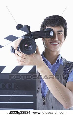 a cameraman behind an action board View Large Photo Image Picture - a cameraman behind an action board . Fotosearch