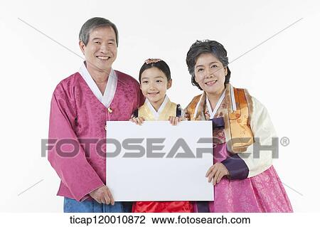 a couple and grand child holding a white board together View Large Photo Image Stock Image - a couple and grand child holding a white board together . Fotosearch